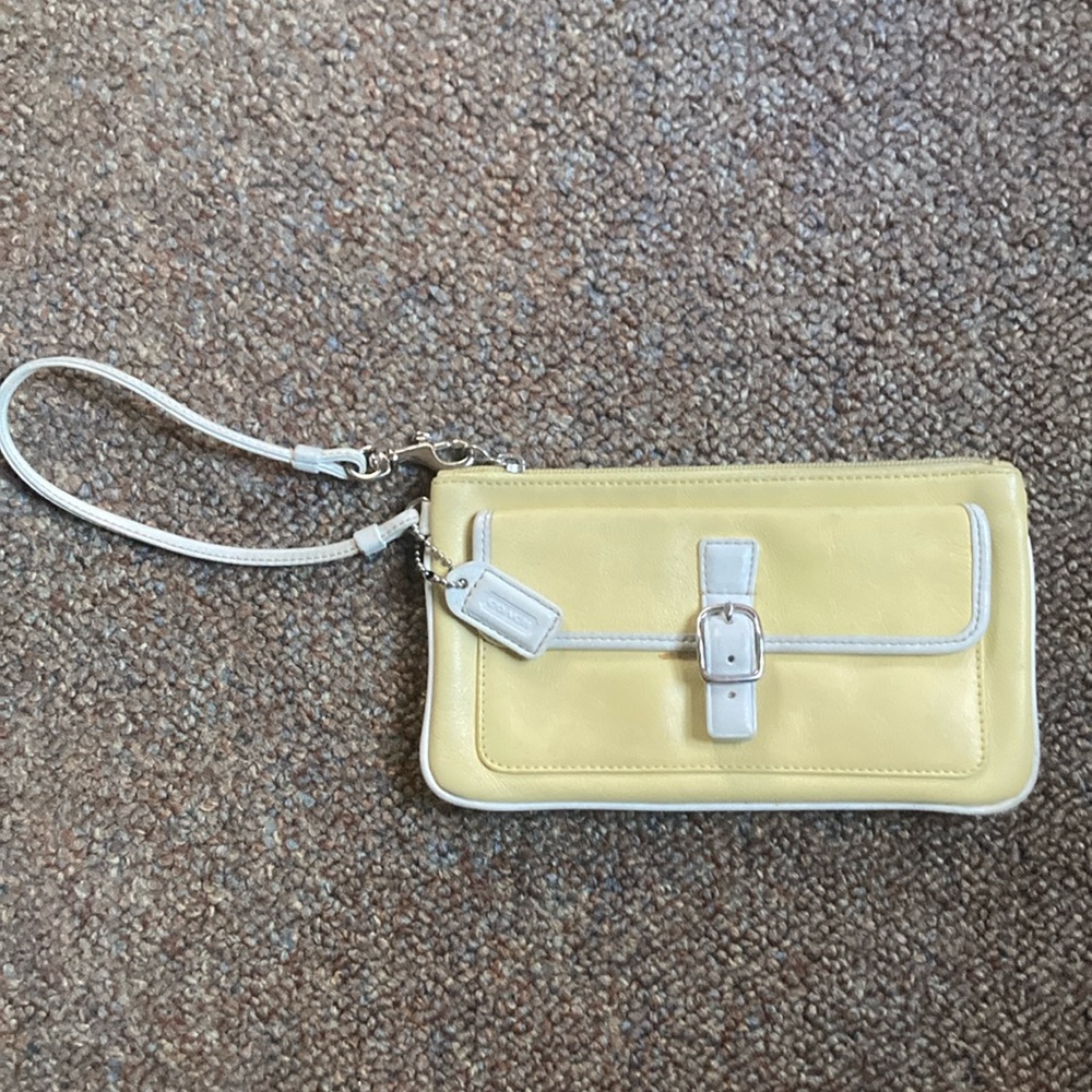 Coach wristlet. Yellow leather, zipper closure. Smoke and pet free household.
